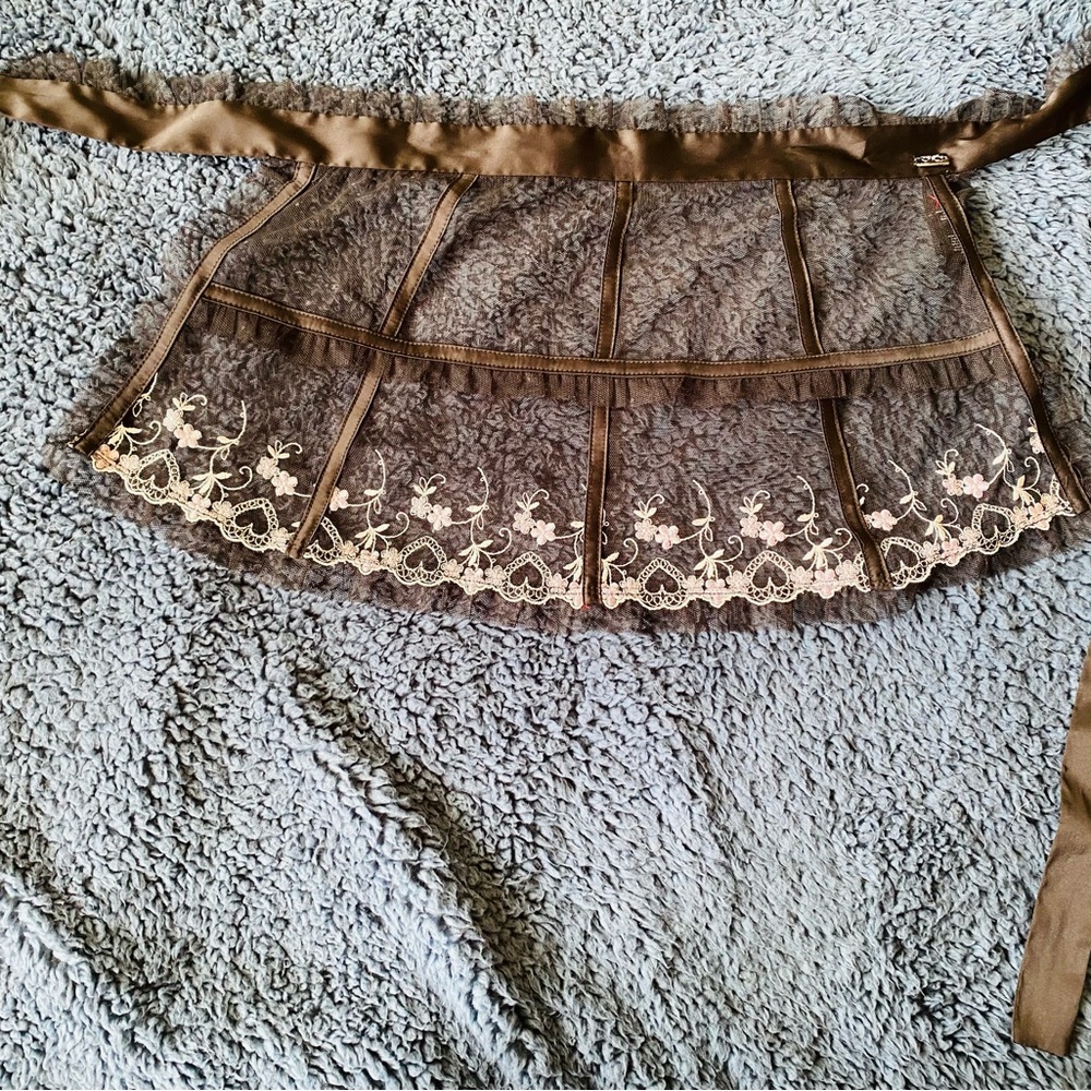 Sheer apron with embroidery trim